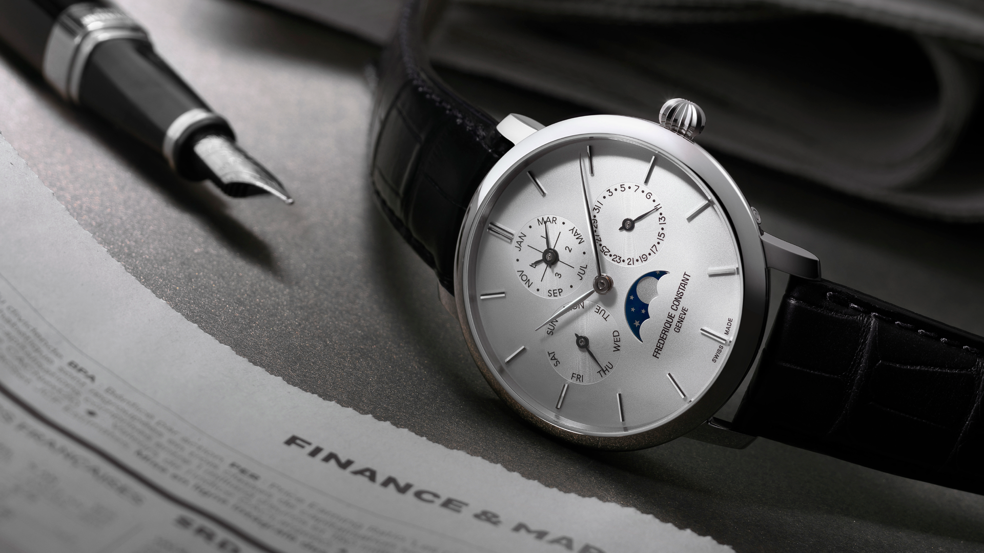 Slimline Perpetual Calendar Manufacture watch for man.   Automatic movement, white dial, stainless-steel case, date, day and month counters, moonphase and black leather strap