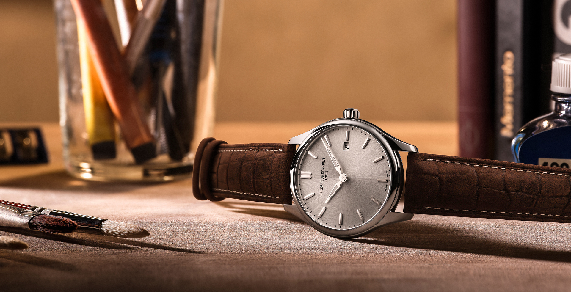 Classic Quartz watch for man. Quartz movement, silver dial, stainless-steel case, date window and brown leather strap 
