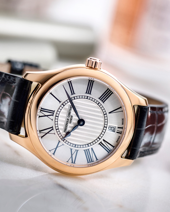 Classics Ladies Quartz watch for woman. Quartz movement, silver dial, rose-gold plated case, date window and black leather strap 