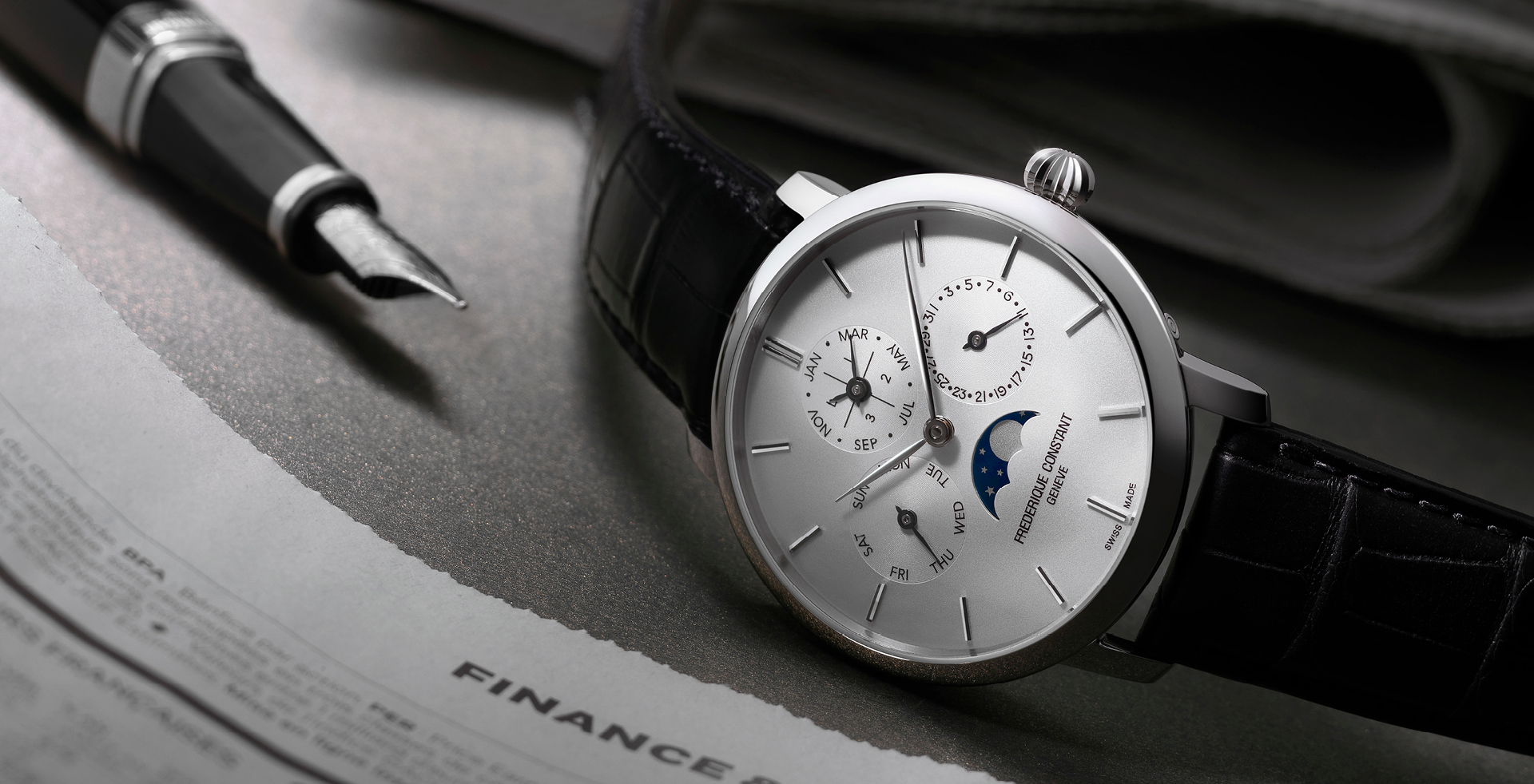 Slimline Perpetual Calendar Manufacture watch for man.   Automatic movement, white dial, stainless-steel case, date, day and month counters, moonphase and black leather strap 