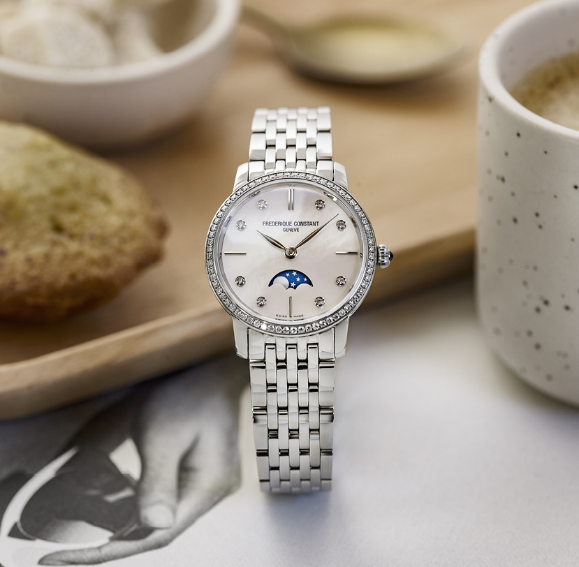 Slimline Ladies Moonphase watch for woman. Quartz movement, white mother of pearl dial with 8 diamonds, stainless-steel case with 68 diamonds, moonphase and stainless-steel bracelet 