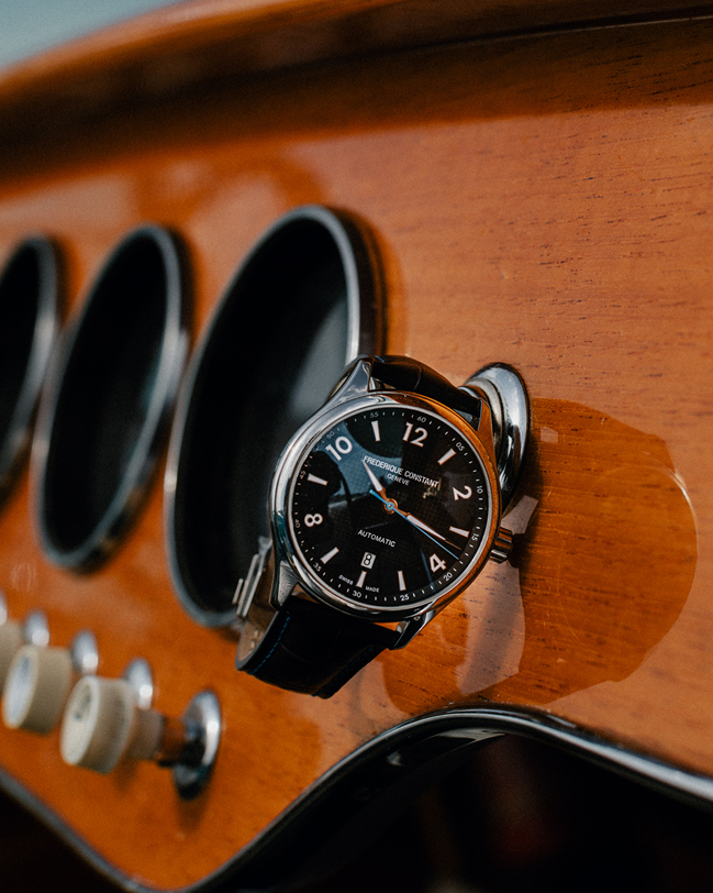 Runabout Automatic watch for man. Automatic movement, black dial with clous de Paris guilloché in the center, stainless-steel case and dark blue-grey leather strap with blue stitching 