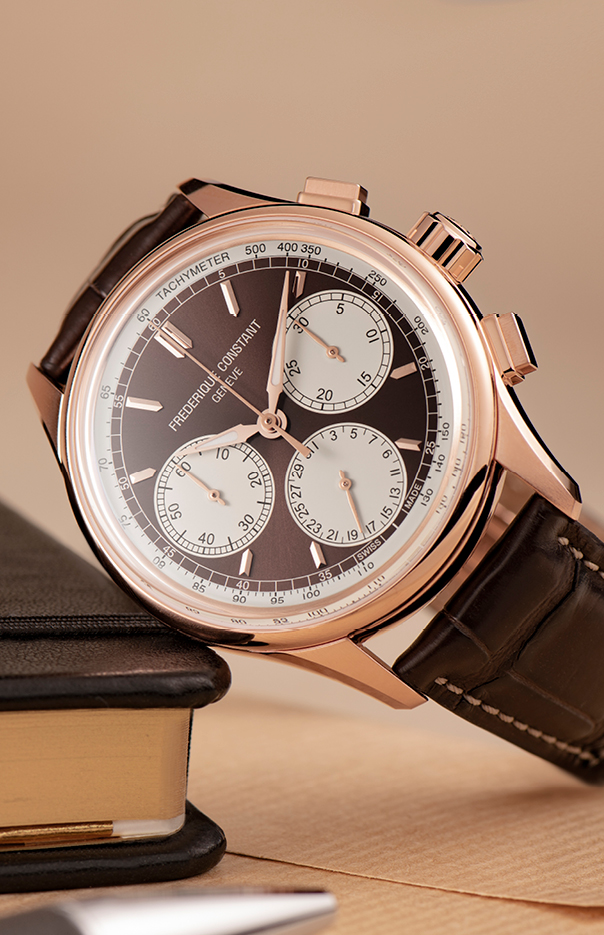 Flyback Chronograph Manufacture watch for man. Automatic movement, white dial, rose-gold plated case, date, seconds and minutes counters, chronograph and brown leather strap 