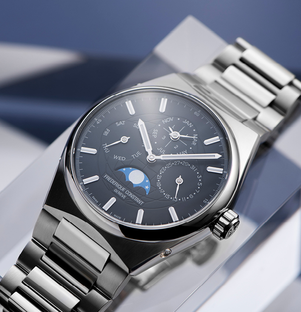Highlife Perpetual Calendar Manufacture watch for man.   Automatic movement, blue-grey dial, stainless-steel case, date, month and day counters, moonphase and stainless-steel integrated and interchangeable bracelet 