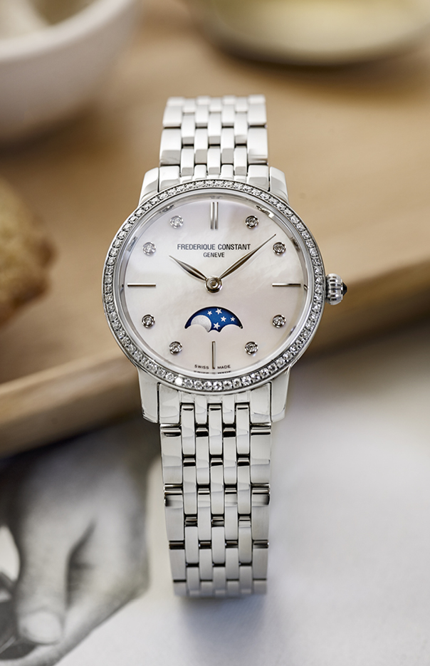 Slimline Ladies Moonphase watch for woman. Quartz movement, white mother of pearl dial with 8 diamonds, stainless-steel case with 68 diamonds, moonphase and stainless-steel bracelet 
