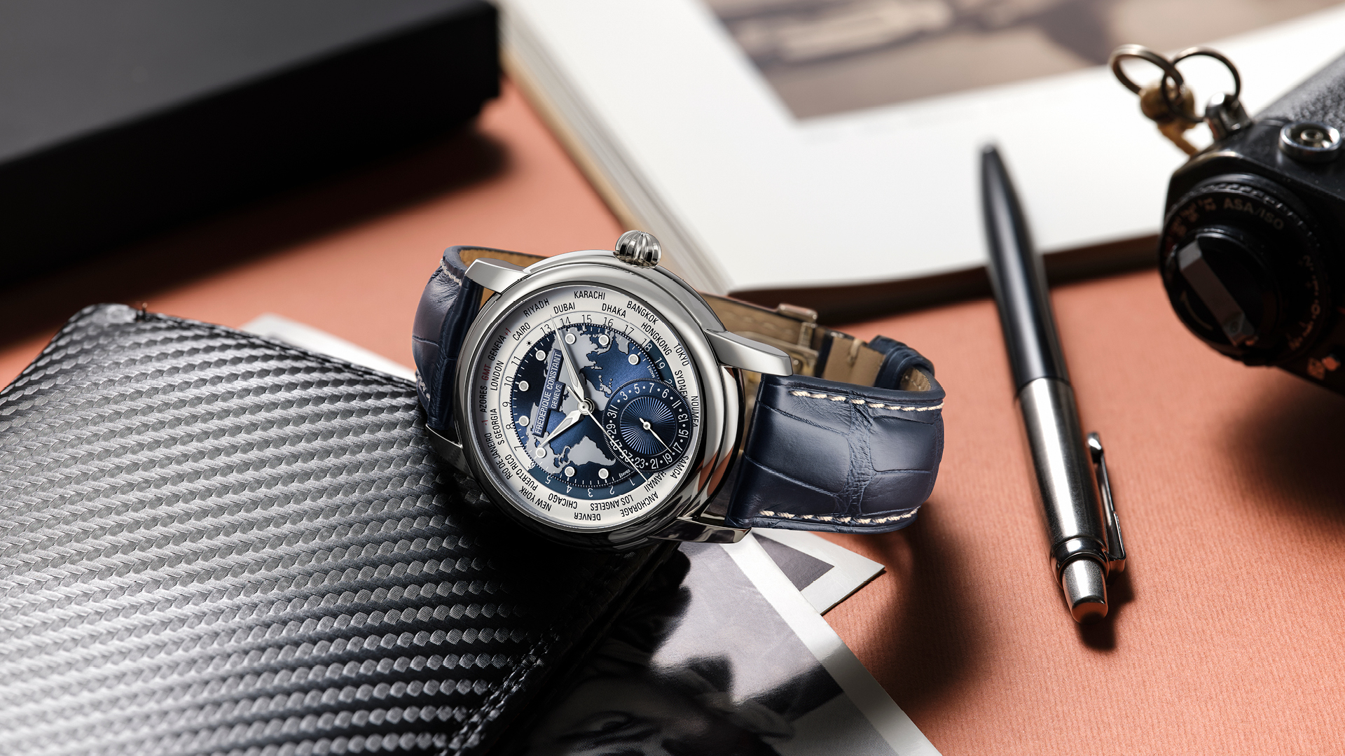 Worldtimer Manufacture watch for man. Automatic movement, grey and blue dial, stainless-steel case, date counter, worldtimer and blue leather strap 
