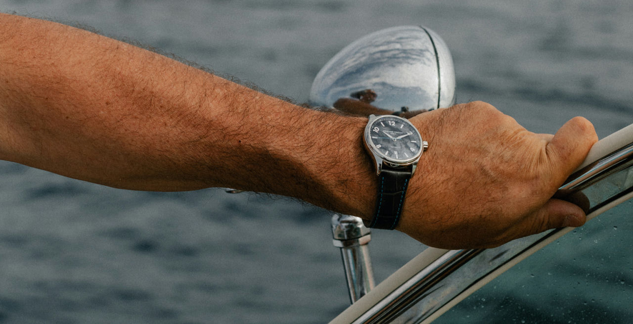 Runabout Automatic watch for man. Automatic movement, black dial with clous de Paris guilloché in the center, stainless-steel case and dark blue-grey leather strap with blue stitching 