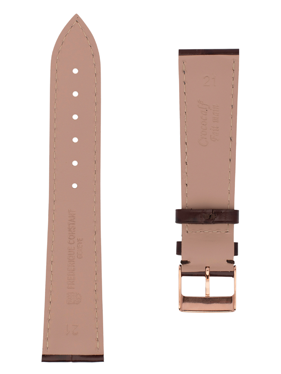 Dark brown calf leather strap with beige lining and dark brown stitching. Rose-gold plated tongue buckle. Width: 21x18mm. Interhorn: 21mm. Length 120x80mm