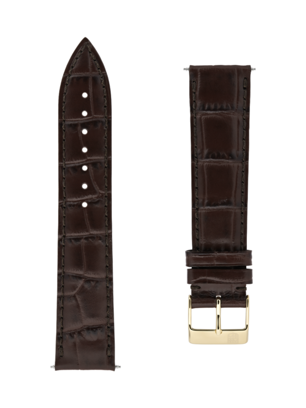 Dark brown calf leather strap with beige lining and dark brown stitching. Yellow gold plated tongue buckle. Width: 20x18mm. Interhorn: 20mm. Length 120x80mm